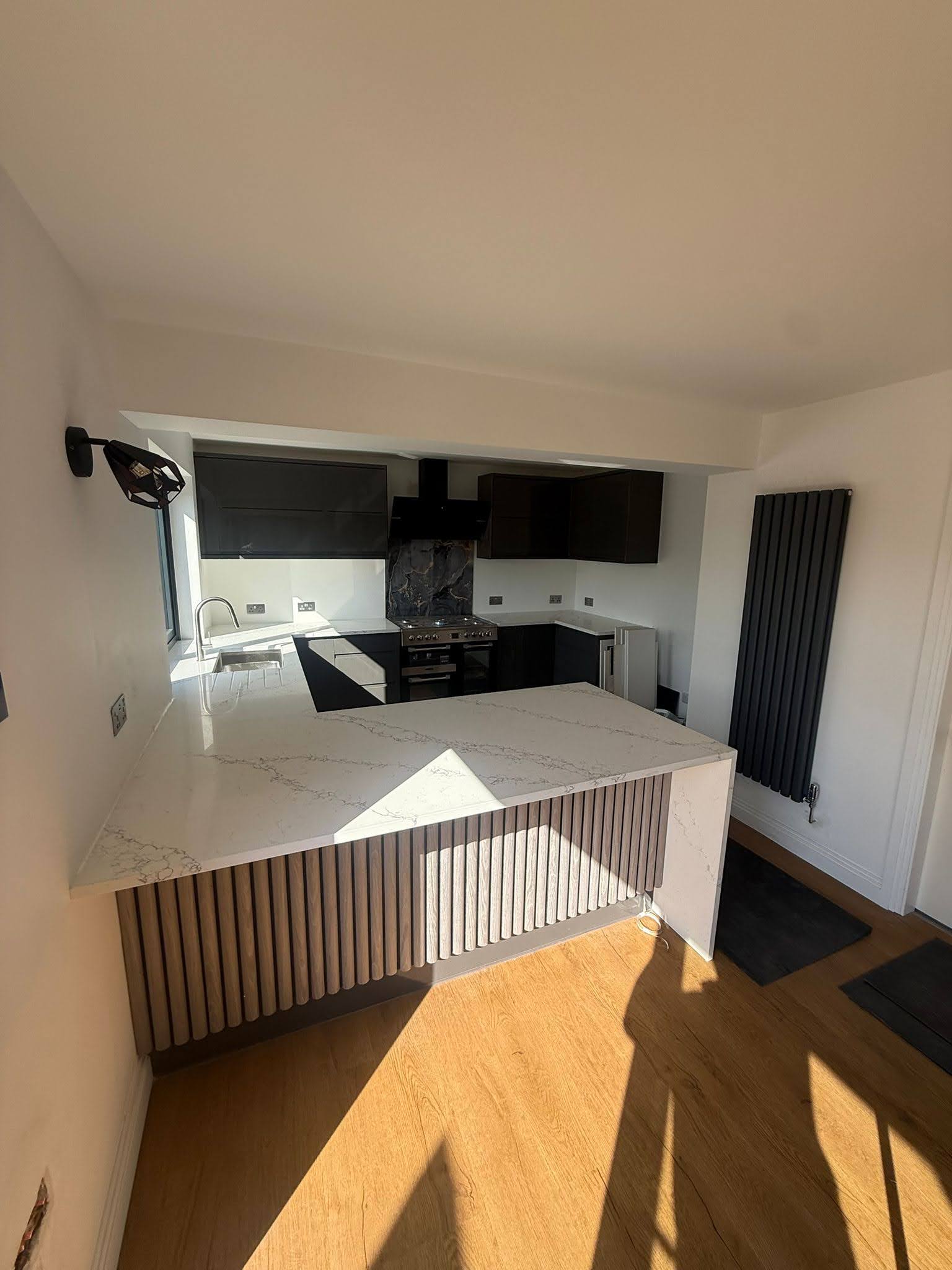 Finished open-plan kitchen after wall removal